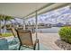 Inviting outdoor patio with views of a calm canal, perfect for relaxing and entertaining at 3181 Gulf Winds Cir, Hernando Beach, FL 34607