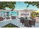 Spacious patio area featuring tile flooring, outdoor seating and dining for entertainment at 3181 Gulf Winds Cir, Hernando Beach, FL 34607