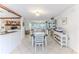 Open-concept dining area with tile flooring, seamlessly connecting to living area, perfect for entertaining at 3181 Gulf Winds Cir, Hernando Beach, FL 34607
