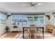 Cozy dining area with large windows overlooking waterfront, creating an inviting space to eat and relax at 3181 Gulf Winds Cir, Hernando Beach, FL 34607