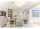 Bright dining area with waterfront view and white accents; a blend of style and comfort at 3181 Gulf Winds Cir, Hernando Beach, FL 34607