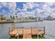 Beautiful waterfront home with dock featuring ladder for easy water access at 3181 Gulf Winds Cir, Hernando Beach, FL 34607