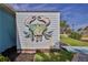 Unique waterfront property featuring a rustic crab sculpture on the shed's exterior at 3181 Gulf Winds Cir, Hernando Beach, FL 34607