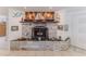 Unique stone fireplace with nautical decor creating a cozy atmosphere at 3181 Gulf Winds Cir, Hernando Beach, FL 34607