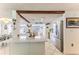 Bright, open kitchen showcasing modern stainless steel appliances and access to the dining space at 3181 Gulf Winds Cir, Hernando Beach, FL 34607