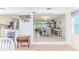 Open-concept living and dining area with neutral colors and tile flooring providing a bright, airy feel at 3181 Gulf Winds Cir, Hernando Beach, FL 34607