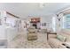 Living area with a fireplace open to the kitchen and dining area and tile floors at 3181 Gulf Winds Cir, Hernando Beach, FL 34607