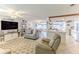 Open-concept living area featuring tile floors and seamless flow to the kitchen at 3181 Gulf Winds Cir, Hernando Beach, FL 34607