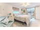 Serene main bedroom with water views, a comfy chair, and neutral tones at 3181 Gulf Winds Cir, Hernando Beach, FL 34607