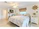 Comfortable main bedroom featuring waterfront decor, neutral colors, and serene lighting at 3181 Gulf Winds Cir, Hernando Beach, FL 34607