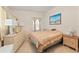 Bedroom with vintage furniture, natural light, and a beach-themed painting at 3317 Nakora Dr, Tampa, FL 33618