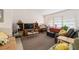 Spacious living room featuring furniture, a large window, and entertainment center at 3317 Nakora Dr, Tampa, FL 33618