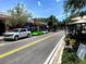 Shopping district with lush greenery and luxury cars parked on the street at 3317 Nakora Dr, Tampa, FL 33618