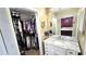 Bathroom with vanity, mirror and walk-in closet at 3907 Orchard Hill Cir, Palm Harbor, FL 34684