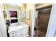 Bathroom featuring a marble vanity and a tiled walk-in shower at 3907 Orchard Hill Cir, Palm Harbor, FL 34684