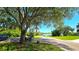 Serene community setting featuring a lake view, gazebo, and paved path, perfect for leisurely strolls at 3907 Orchard Hill Cir, Palm Harbor, FL 34684