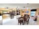 Inviting dining area with access to the kitchen, ideal for Gathering meals and entertaining guests at 3907 Orchard Hill Cir, Palm Harbor, FL 34684
