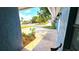 View of the front yard featuring a tiled walkway and a landscaped garden at 3907 Orchard Hill Cir, Palm Harbor, FL 34684