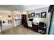 Open office space with a view of the dining room and living room, featuring ample natural light at 3907 Orchard Hill Cir, Palm Harbor, FL 34684