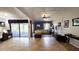 Spacious living room with tiled floors, decorative ceiling, and sliding glass doors to the patio at 3907 Orchard Hill Cir, Palm Harbor, FL 34684