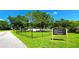 Community playground area for Lake St. George residents featuring a fenced-in area for and a walking path at 3907 Orchard Hill Cir, Palm Harbor, FL 34684