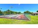 Community tennis courts with green fencing, providing recreational opportunities in a well-maintained park setting at 3907 Orchard Hill Cir, Palm Harbor, FL 34684