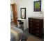 Bedroom features a dresser and vanity area with makeup mirror at 4051 58Th N St # 241C, Kenneth City, FL 33709
