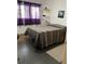 Bedroom with natural light, dark floors, and minimalist decor at 4051 58Th N St # 241C, Kenneth City, FL 33709