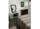 Bedroom features a dresser and vanity area with makeup mirror at 4051 58Th N St # 241C, Kenneth City, FL 33709