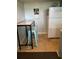 Eat-in kitchen has blue stools and tile floors near white refrigerator at 4051 58Th N St # 241C, Kenneth City, FL 33709