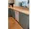 Kitchen features blue cabinets, laminate countertop and a dishwasher at 4051 58Th N St # 241C, Kenneth City, FL 33709
