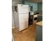 Eat-in kitchen features white refrigerator, oven and laminate countertops at 4051 58Th N St # 241C, Kenneth City, FL 33709