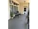 Inviting patio area with comfortable chairs and a small table; potted plant adds a natural touch at 4051 58Th N St # 241C, Kenneth City, FL 33709