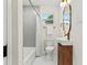 Charming bathroom featuring a shower-tub combination, elegant vanity, and stylish fixtures at 411 37Th S St, St Petersburg, FL 33711