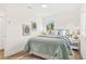 Inviting bedroom featuring a cozy bed, side table, and natural light streaming through the window at 411 37Th S St, St Petersburg, FL 33711