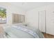 Bedroom featuring a comfortable bed, ample closet space, and natural light from the window at 411 37Th S St, St Petersburg, FL 33711