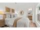 Serene bedroom showcasing a comfortable bed, elegant decor, and an ensuite bathroom with a modern vanity at 411 37Th S St, St Petersburg, FL 33711