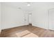 Bright bedroom with wood-look flooring, and a closet at 411 37Th S St, St Petersburg, FL 33711