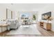 Bright living room with comfortable seating, hardwood floors, and a view to front yard at 411 37Th S St, St Petersburg, FL 33711
