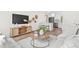 Cozy living room with stylish furniture, hardwood floors, and a modern entertainment center at 411 37Th S St, St Petersburg, FL 33711