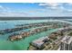 Expansive aerial view of waterfront homes with docks along picturesque canals and waterways, under a sunny sky at 415 Island Way # 303, Clearwater Beach, FL 33767