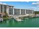 Building and docks on the water, with multiple boat slips available at 415 Island Way # 303, Clearwater Beach, FL 33767