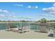 Outdoor seating and stainless steel grill on balcony overlooking the water at 415 Island Way # 303, Clearwater Beach, FL 33767