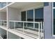 Private balcony overlooking the water with glass railings at 415 Island Way # 303, Clearwater Beach, FL 33767