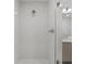 Modern bathroom featuring a tiled shower with glass door at 415 Island Way # 303, Clearwater Beach, FL 33767