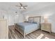 Comfortable bedroom features neutral tones, natural light, and an elegant bedside table at 415 Island Way # 303, Clearwater Beach, FL 33767