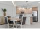 Living room area with water views and access to outdoor balcony at 415 Island Way # 303, Clearwater Beach, FL 33767