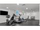 Bright gym featuring cardio equipment including elliptical, treadmill, stationary bike, bench, and free weights at 415 Island Way # 303, Clearwater Beach, FL 33767