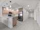 Bright kitchen with stainless steel appliances, light cabinetry, and easy access to living area at 415 Island Way # 303, Clearwater Beach, FL 33767