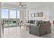 Bright living room features water views, neutral decor, and plenty of seating at 415 Island Way # 303, Clearwater Beach, FL 33767
